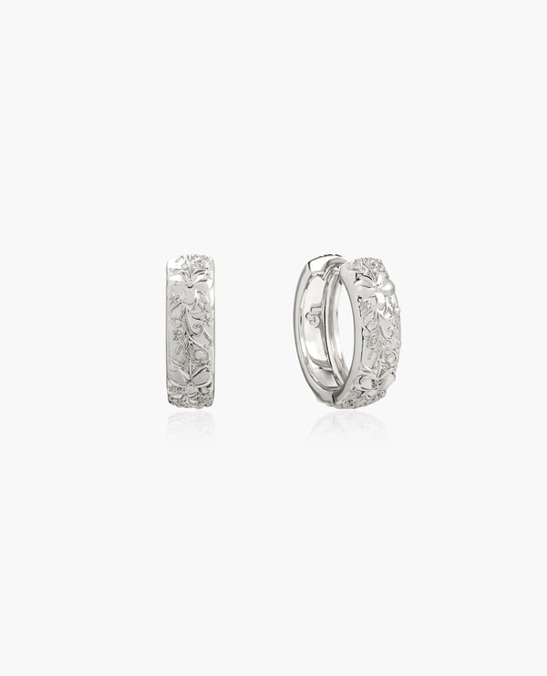 Mini Serenade of Orchid Hoops: Silver hoop earrings with intricate floral engraving, 10mm diameter.