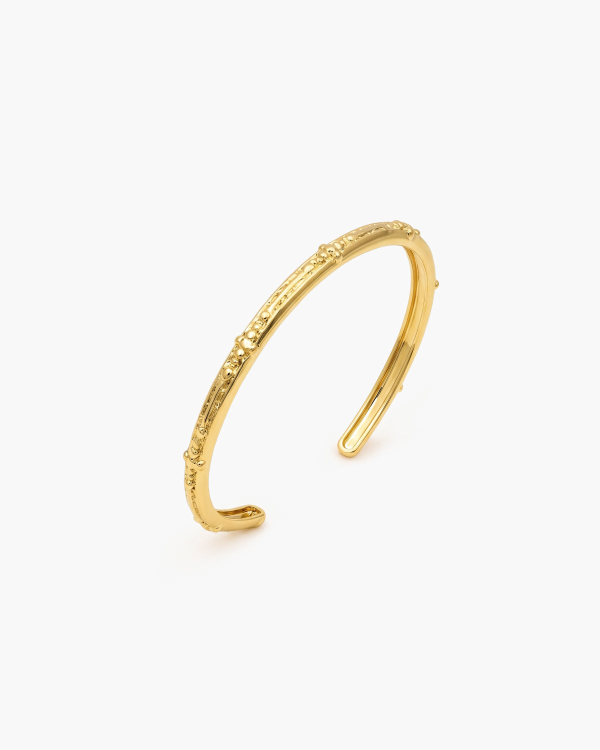 Korallrevstexturerad armring i guld -TBC