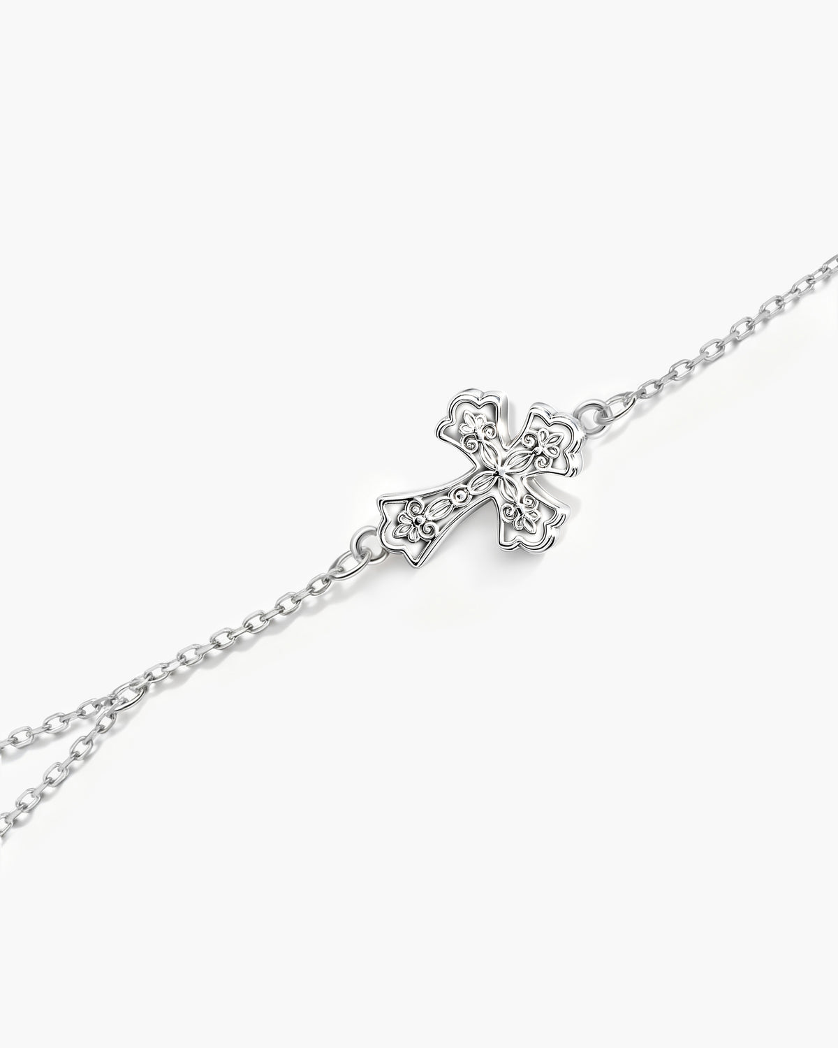 Cadena de mano con dije de cruz relicario