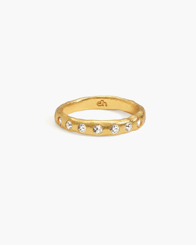 Amelie ring in silver with textured gold band and embedded cubic zirconia stones. en logo inside band.